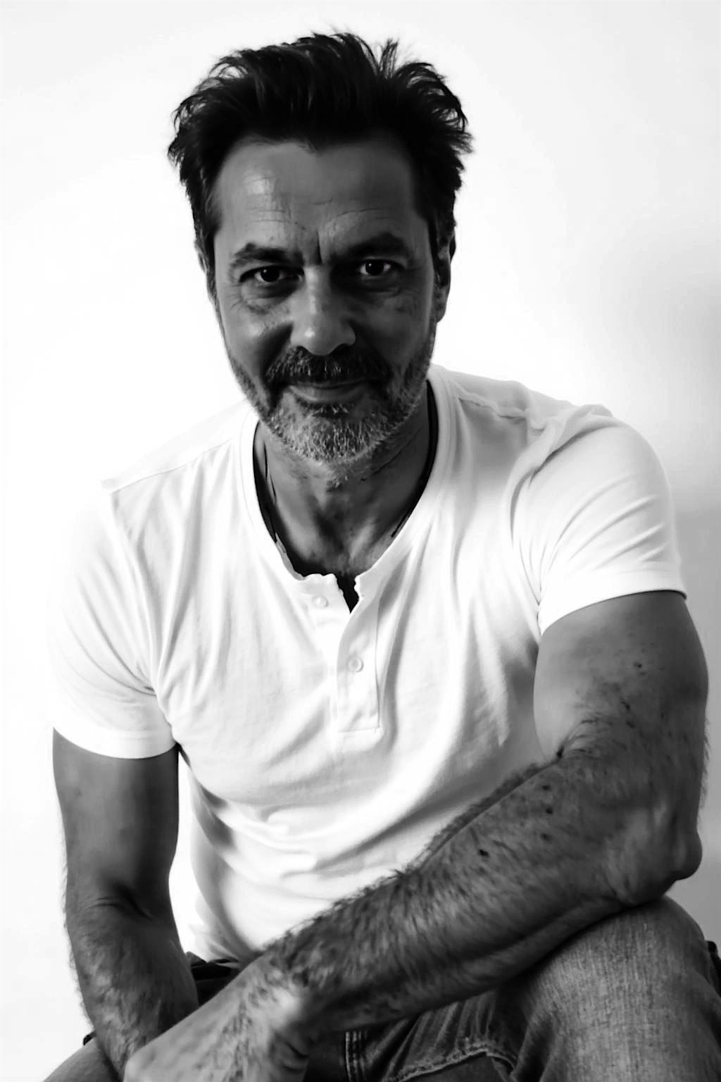Bruce Mackay — seated portrait, monochrome